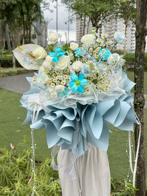 A L size luxury floral arrangement with white roses and bright blue flowers, perfect for birthdays or anniversaries.