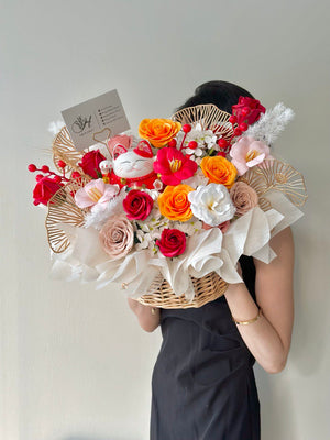 A lucky cat figurine centerpiece surrounded by soap flowers in a basket, perfect for grand openings or business blessings.