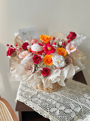 Opening gift basket filled with mixed soap flowers and a lucky cat charm, symbolizing prosperity and success.
