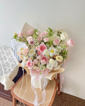 Beautifully arranged spring bouquet showcasing soft textures, fresh petals, and harmonious pink-white color palette.