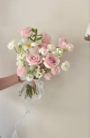 Soft pink and white floral arrangement perfect for a bridal hand bouquet.