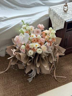 Premium cappuccino rose arrangement with orchid and pastel blooms in stylish ballet wrapper, online florist Kuala Lumpur and Selangor.