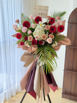 Elegant business opening flower stand in red, pink and white tones featuring generous floral styling and modern wrapping. Same day grand opening flower delivery available across Klang Valley, Kuala Lumpur and Selangor.
