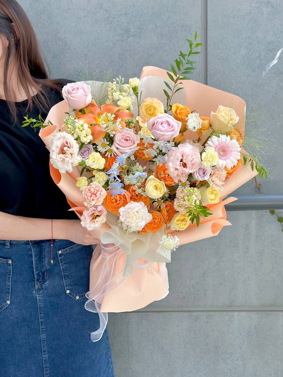 Stylish orange and pastel bouquet wrapped in peach paper – florist shop at KL and Selangor.