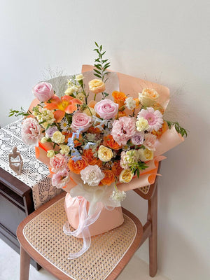 Fresh peach, yellow, and pink flower bouquet for birthday celebration in Malaysia