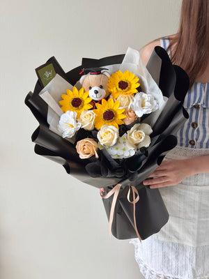 A bouquet of sunflower soap flower with cappuccino roses soap flower and 1 graduation brown bear, perfect convocation gift with same-day delivery to Sunway University and Taylor's University.