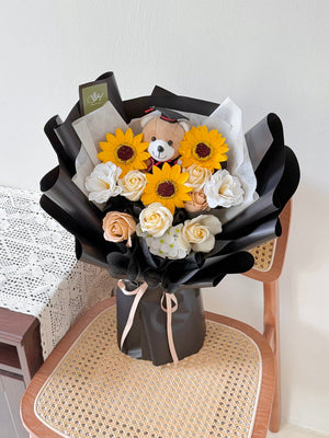 A bouquet of sunflower soap flower with brown graduation bear, same-day delivery to Sunway University and universities across Kuala Lumpur.