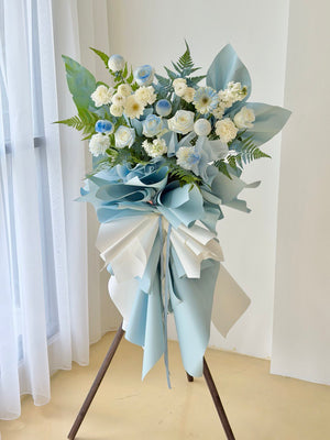 Blue theme grand opening flower stand with white roses and blue gerbera for same day delivery in Kuala Lumpur florist shop prepared by hug and heart florist.
