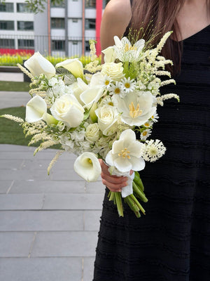 Person holding a bouquet of white calla lily bridal hand bouquet outdoor at Subang Jaya.