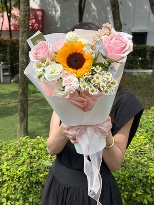 Premium sunflower bouquet with fresh pink roses, chamomile daisies, white eustoma and elegant wrapping, perfect for graduation bouquet, birthday flowers and same day delivery in KL and Selangor.