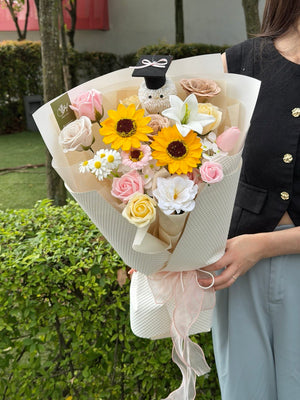 A girl is holding a bouquet of graduation soap flower for her graduation at IMU Graduation Bukit Jalil.