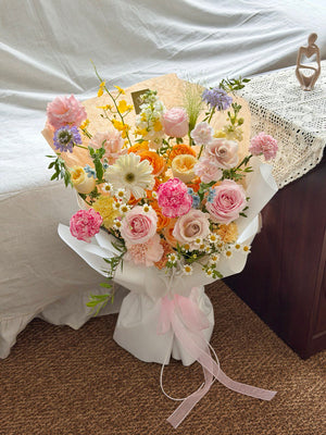 Elegant pastel bouquet with mixed flowers including roses and gerbera, perfect for gift delivery.