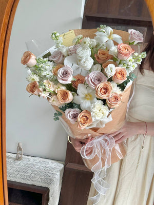 Hand-held 45-stem mixed rose bouquet with cappuccino and menta roses, perfect for anniversary or celebration.