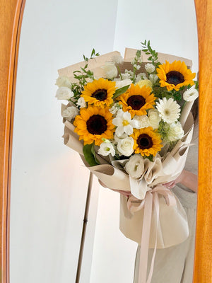 Yellow sunflower bouquet with white flowers, perfect for graduation gifts and celebrating academic achievements.
