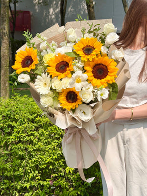 Sunflower graduation bouquet with white roses and elegant beige wrapping for graduation flower delivery in KL and Selangor.