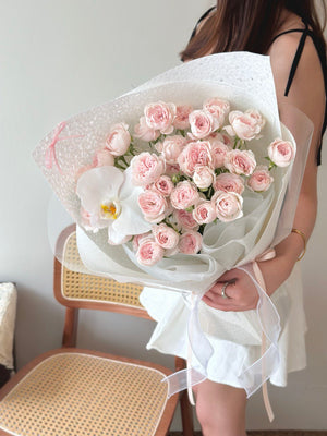 A girl is holding a kiss of fairy bouquet ready for her birthday celebration at Kuala Lumpur Malaysia.