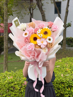 A girl is holding a bouquet of Soap Flower for her graduation - prepared by hug and heart florist subang jaya.