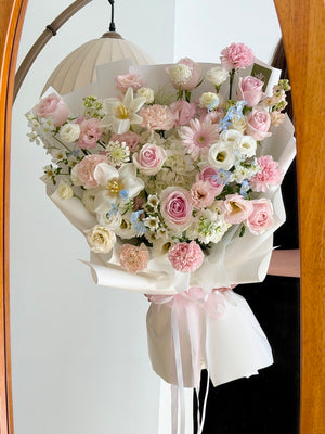 Elegant anniversary flower bouquet featuring one white hydrangea, premium pink roses and fresh seasonal flowers.