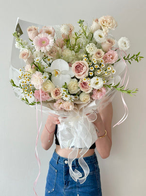 A bouquet of flower mixed with quicksand rose, pink gerbera and fillers with same-day delivery flower in Malaysia.