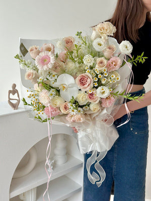 Fresh Quicksand roses with daisy, chamomile flowers and pastel blooms in Malaysia.