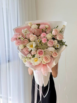 Elegant birthday flower bouquet featuring pink roses, white orchids and fresh seasonal flowers in Kuala Lumpur.