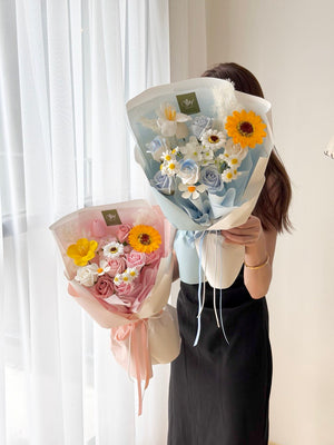 A girl is holding a soap flower with sunflower perfect for graduation at university at Subang Jaya, Bukit Jalil.