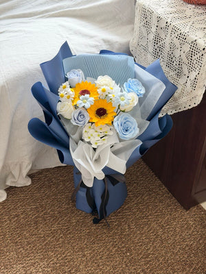 Elegant graduation soap flower bouquet featuring sunflowers, blue roses, and white blooms for graduates in Sunway.