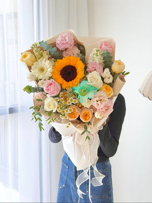 Graduation sunflower bouquet with white roses, pink carnations, gerbera, chamomile and premium fresh flowers for graduation ceremony in Sunway, Bukit Jalil, Kuala Lumpur.