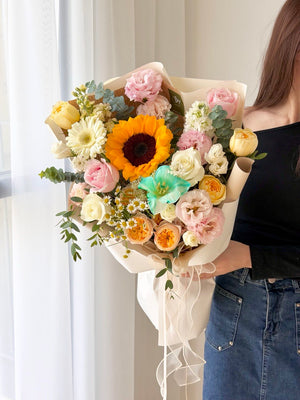 Luxury graduation sunflower flower bouquet featuring pastel roses, white blooms, eucalyptus and bright sunflower with same day flower delivery in KL and Selangor.