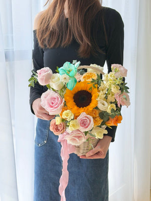 Elegant sunflower basket arrangement with pink roses, white roses, and fresh flowers perfect for hospital visits and get well gifts.