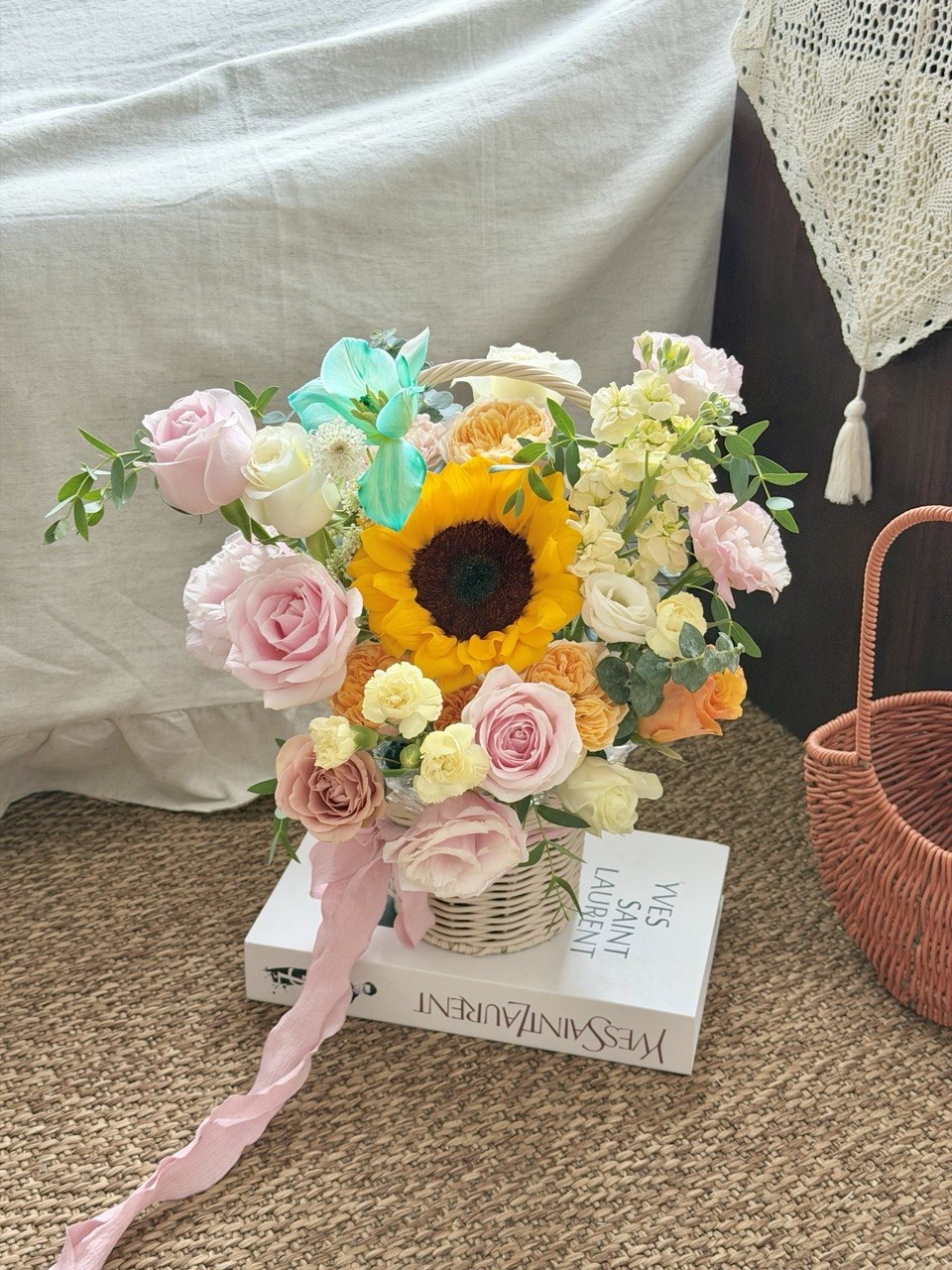 Bright sunflower recovery flower basket featuring pastel roses, carnations, and fresh seasonal flowers for get well soon wishes.