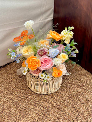 A vibrant basket of flowers, ideal for get well soon or housewarming gifts.