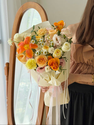 Elegant orange tulip flower bouquet with peach roses and white blooms for birthdays, anniversaries, and same day flower delivery by Hug and Heart Florist Sunway Geo.