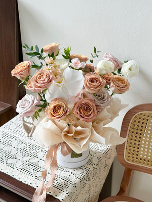 Romantic cappuccino rose flower basket featuring cappuccino and blush roses with white orchids, suitable for birthday and anniversary flower delivery in Kuala Lumpur.