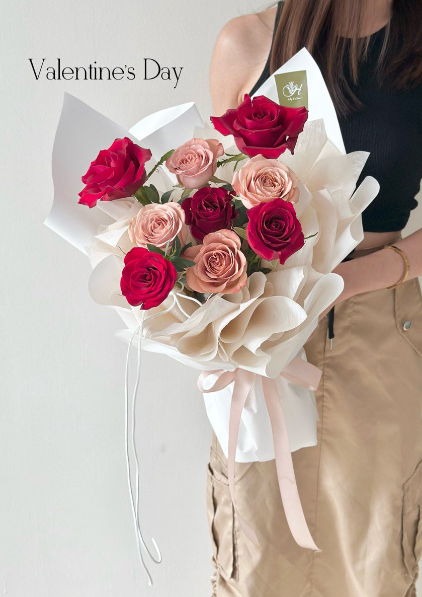 Valentine 2026 red and blush rose bouquet by KL florist, romantic flower gift wrapped in elegant white paper.