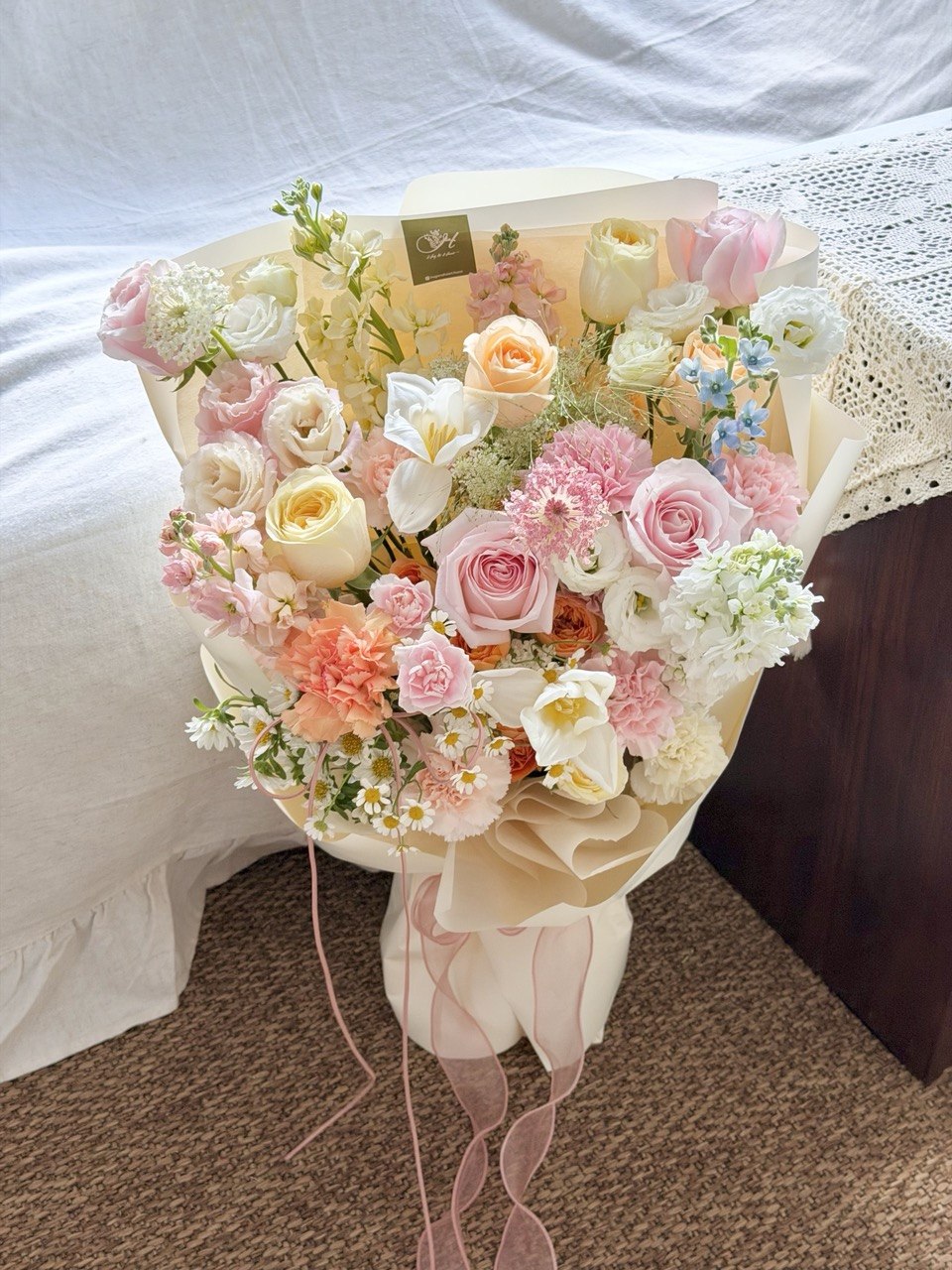 Luxury fresh flower bouquet with pink roses, white blooms, and delicate filler flowers prepared by hug and heart florist subang jaya.