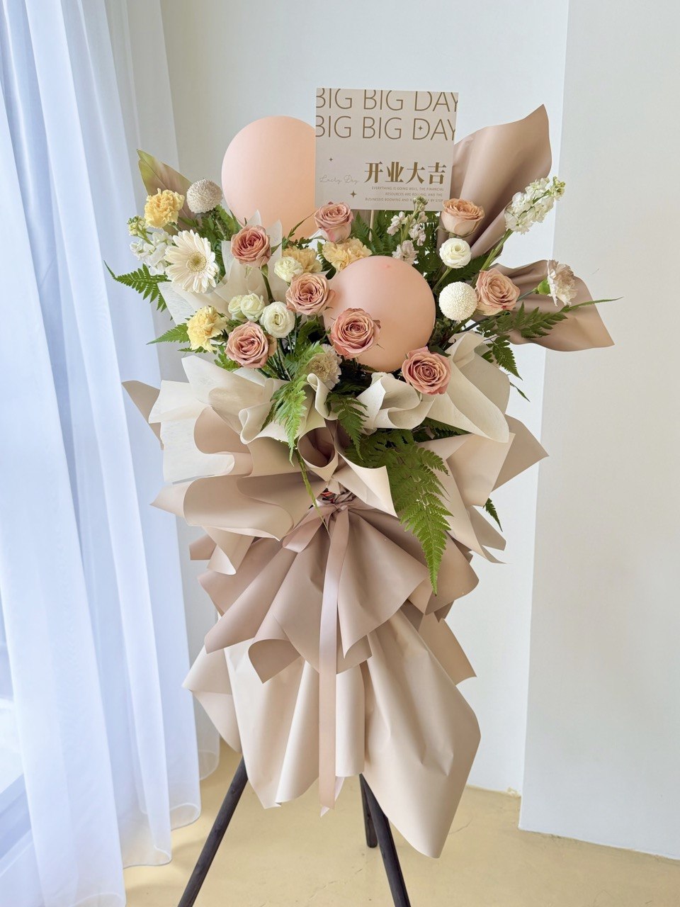 Cappuccino brown grand opening flower stand with neutral toned flowers and elegant arrangement with same day flower stand delivery.