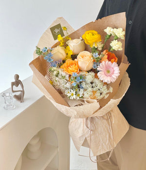 A girl in a black top proudly displays a colorful bouquet at Subang Jaya.