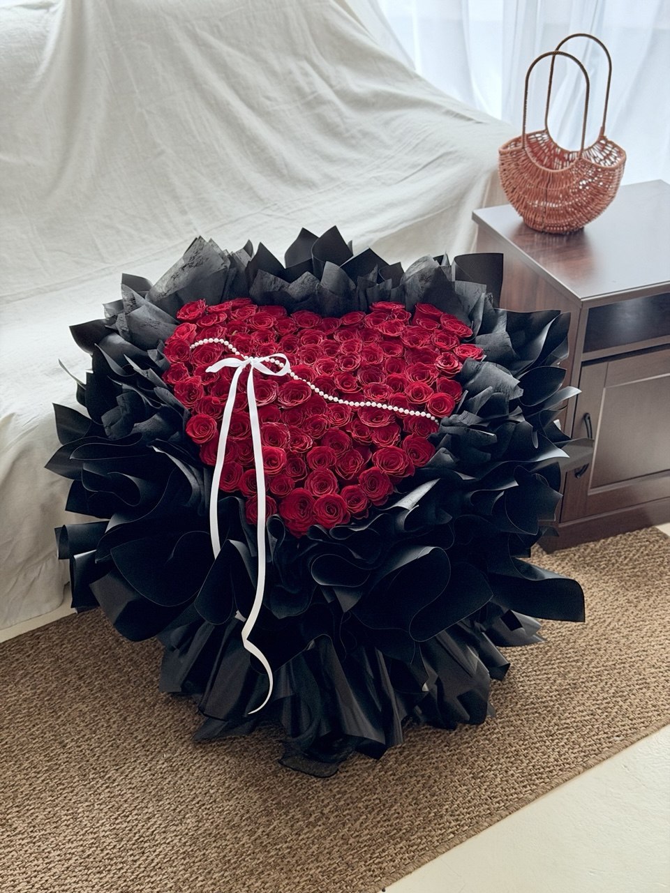 99 red roses bouquet with elegant black wrapper, perfect for marriage proposal in Kuala Lumpur.
