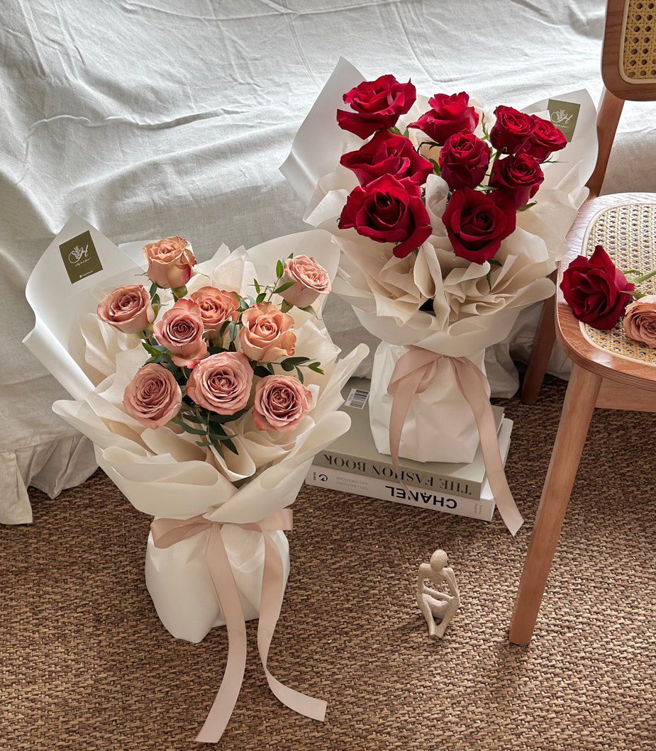 Bouquets of red and cappuccino roses on a textured surface with a chair in the background perfect for Valentine flower at Kuala Lumpur.