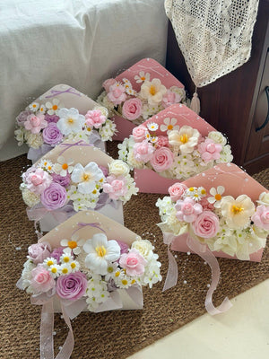 Luxury envelope style soap flower bouquet featuring pink roses, lavender rose, white tulip, and white daisies with premium gift wrapping.
