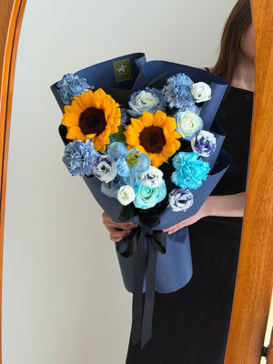 Bright sunflower and blue theme bouquet with tulips, roses and carnations, perfect graduation gift Bukit Jalil Kuala Lumpur florist.