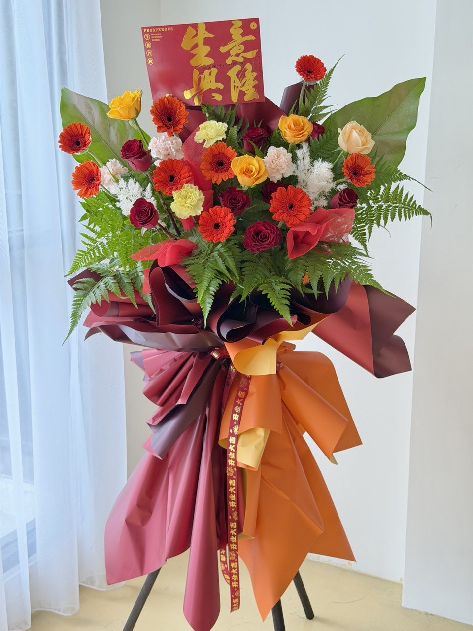 A red business opening flower stand perfect gift for business opening with same day delivery opening stand Kuala Lumpur and Selangor.