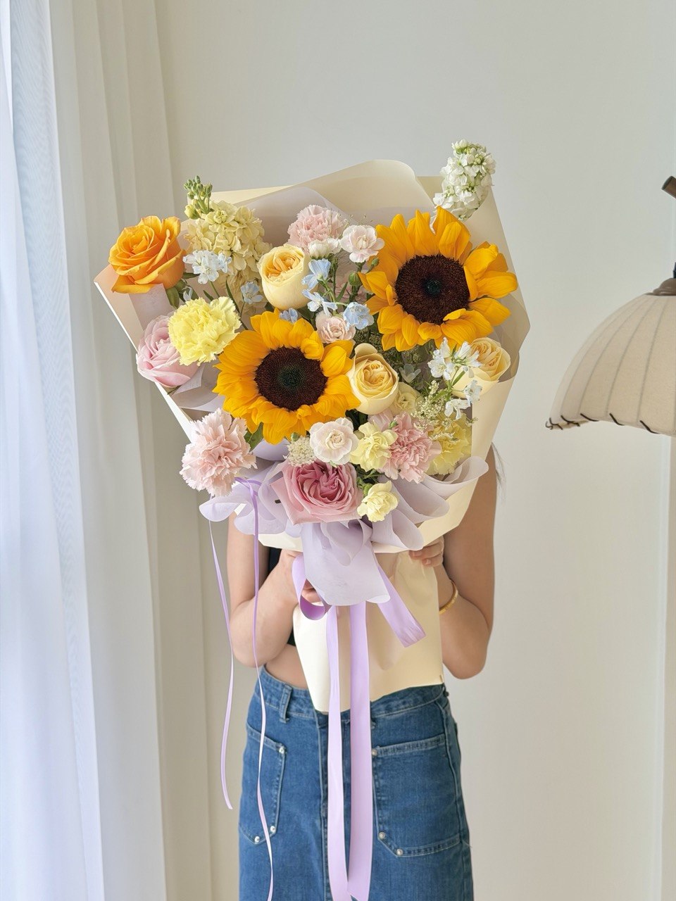 Sunflower bouquet with pink roses and buttercup roses in soft pastel theme, perfect graduation flower delivery in Bukit Jalil, Subang Jaya, Cheras and Kuala Lumpur.