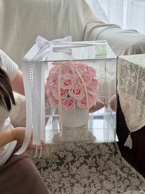 Luxury soap flower bouquet in a transparent acrylic box featuring pastel pink roses, ideal birthday gift and special occasion present.