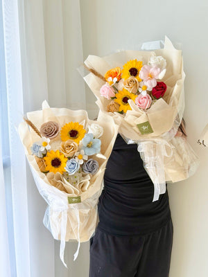 Sunflower themed soap flower bouquet with pastel roses, perfect graduation gift for college and university students.