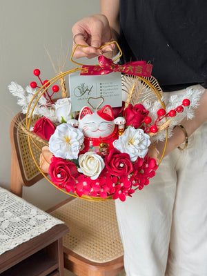 A red lucky cat is place within soap flower for business grand opening gift.