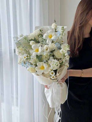 Romantic white and pastel blue flower bouquet with fresh roses, plumeria, delphinium and chamomile flowers, perfect for birthdays, congratulations and celebrations in Malaysia.