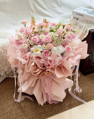 Soft pink luxury bouquet with hydrangeas, roses, carnations and delicate flowers.