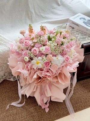 Pink hydrangea ballet bouquet with soft pink roses and delicate white flowers.
